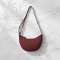 Bordeaux Crescent Bag Flat Lay